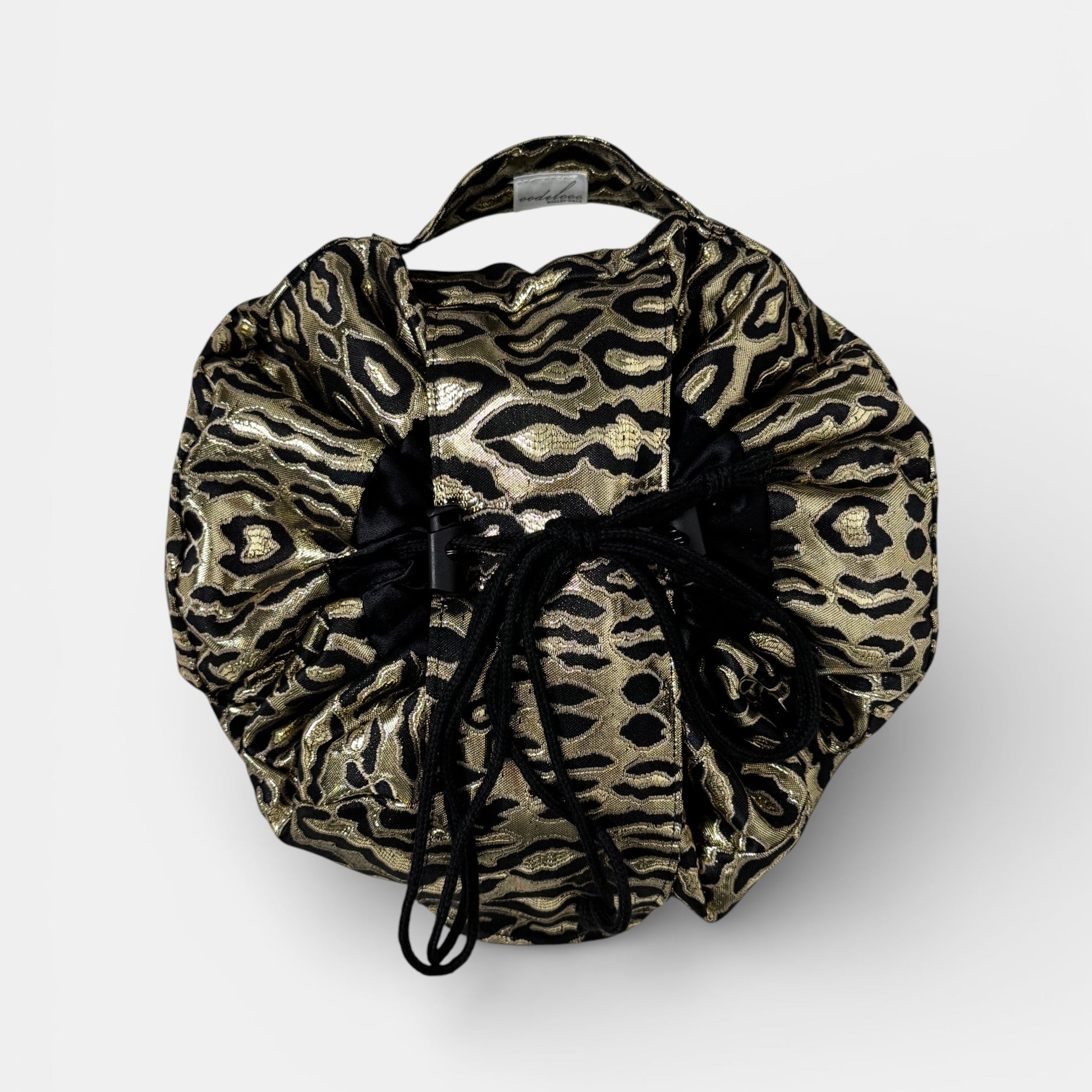 Leopard print drawstring bag on a white background