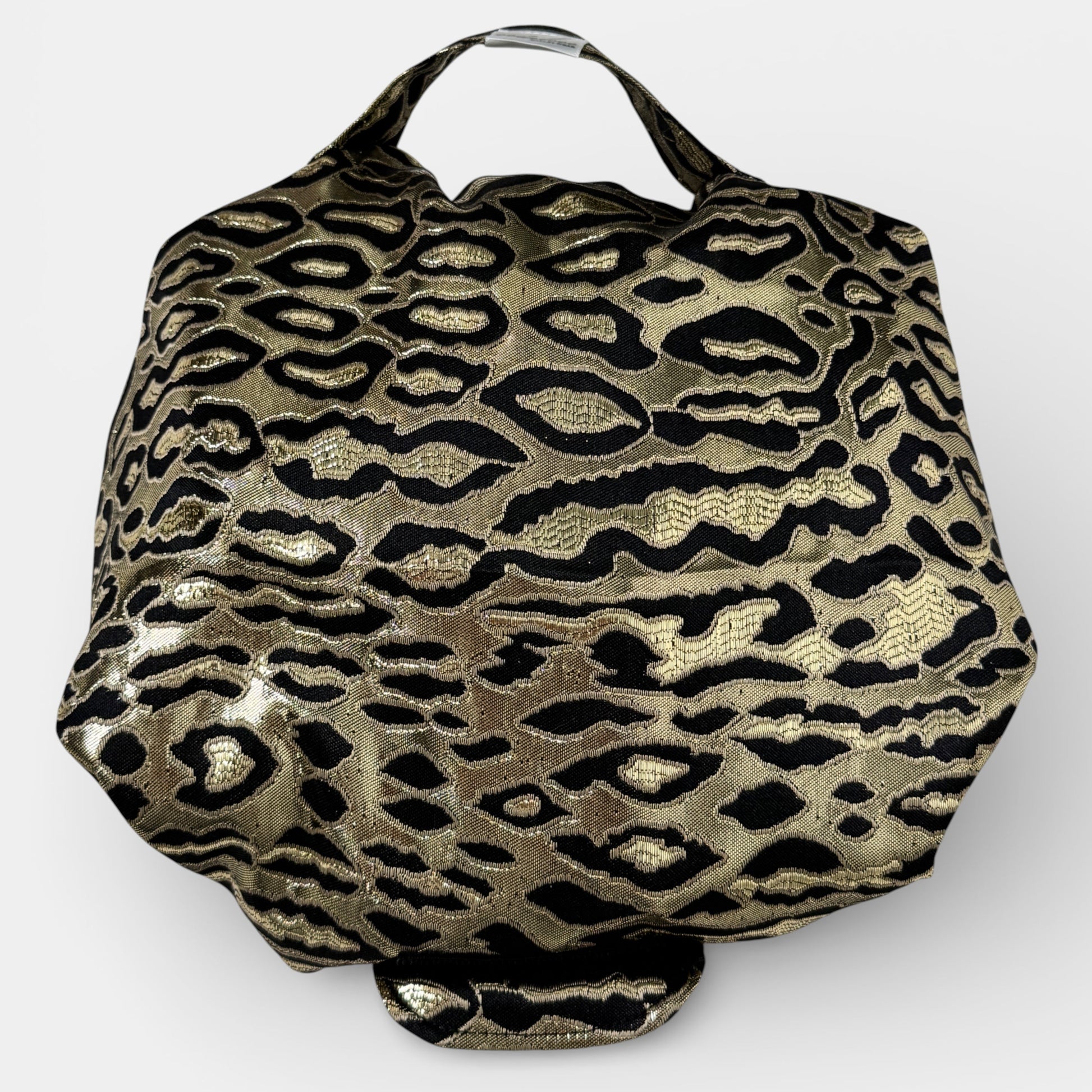 Gold and black leopard print bag on a white background
