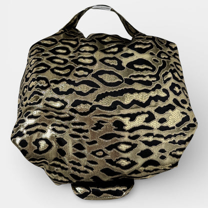 Gold and black leopard print bag on a white background