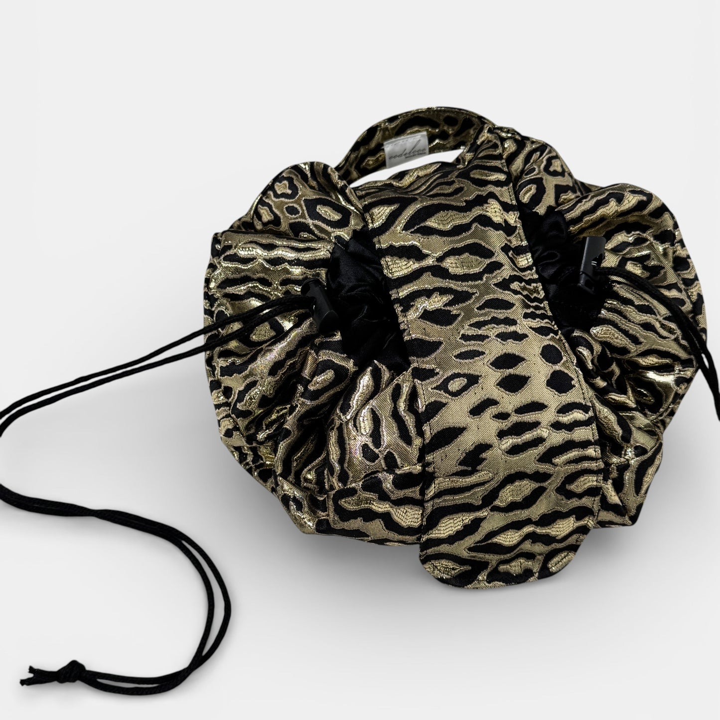 Leopard print drawstring bag on a white background
