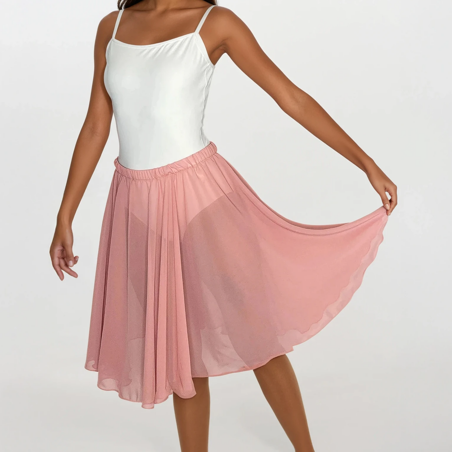 Woman wearing a white top and pink skirt on a white background
