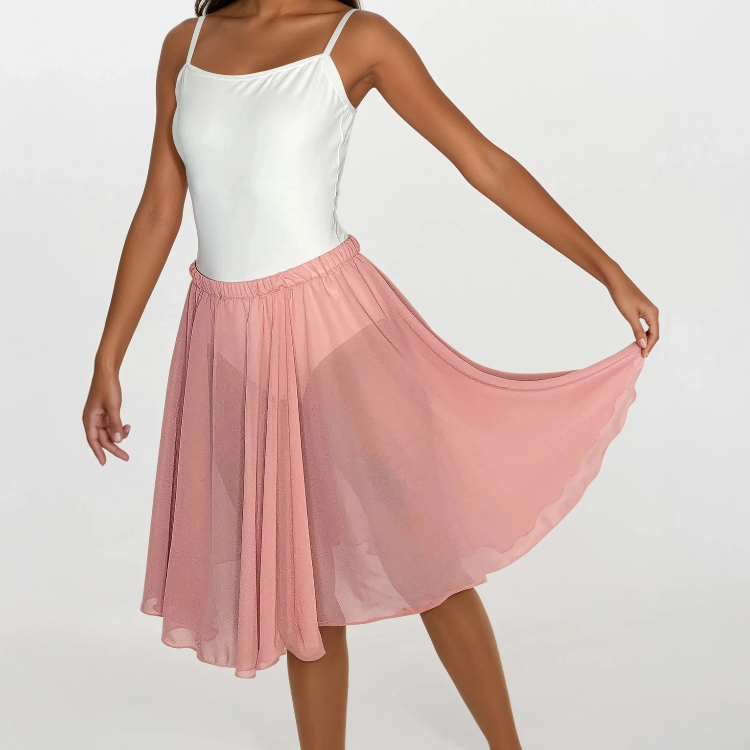 Woman wearing a white top and pink skirt on a white background